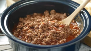 Do I have to brown ground beef before slow cooker? 5 "A skillet of browned ground beef ready for a slow cooker recipe."