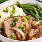 Juicy Lipton Onion Soup Meatloaf served with mashed potatoes and green beans