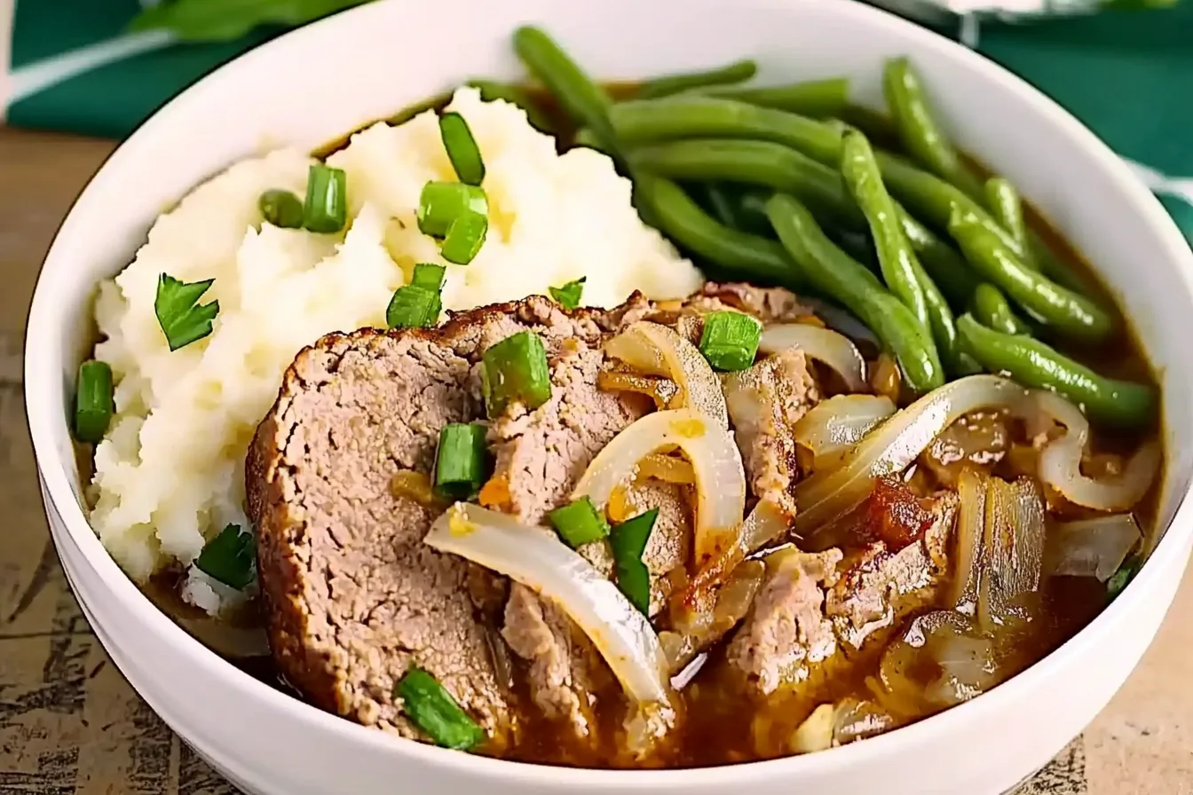 Juicy Lipton Onion Soup Meatloaf served with mashed potatoes and green beans